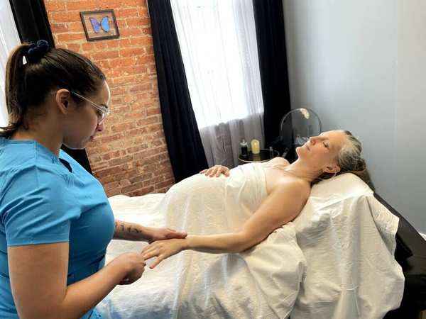 Prenatal massage face up with a licensed massage therapist